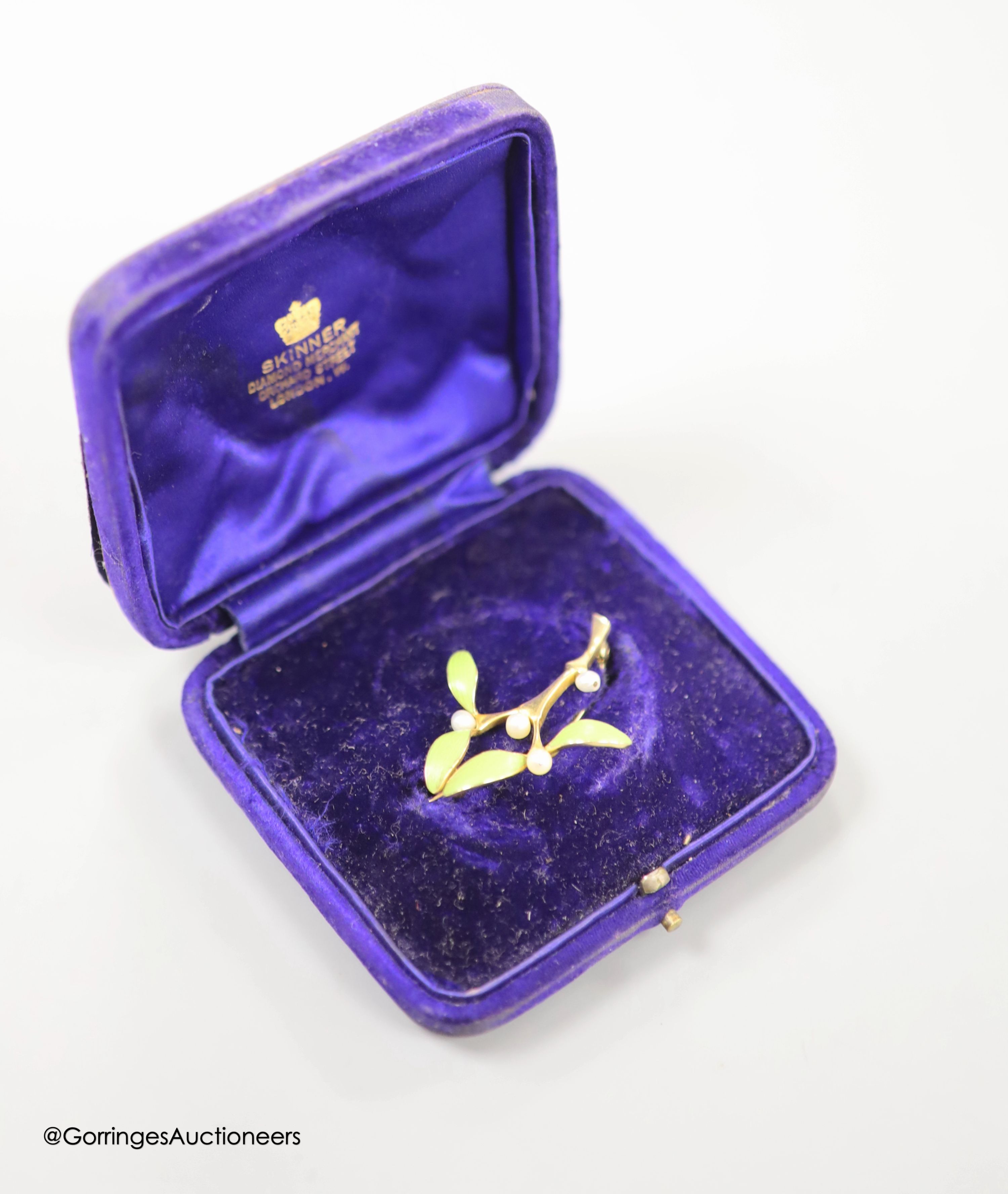 An Art Nouveau yellow metal, green enamel and seed pearl set foliate brooch, 38mm, gross weight 5.2 grams.